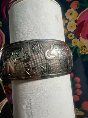 Silver-Tone Elephant Cuff Bracelet with Sun Motif has flexibility